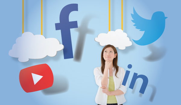 A woman thinking with the facebook, twitter, linkedin, and youtube logos hovering around her head.